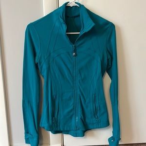 Blue green define jacket lululemon. Worn but in good condition. Size 4